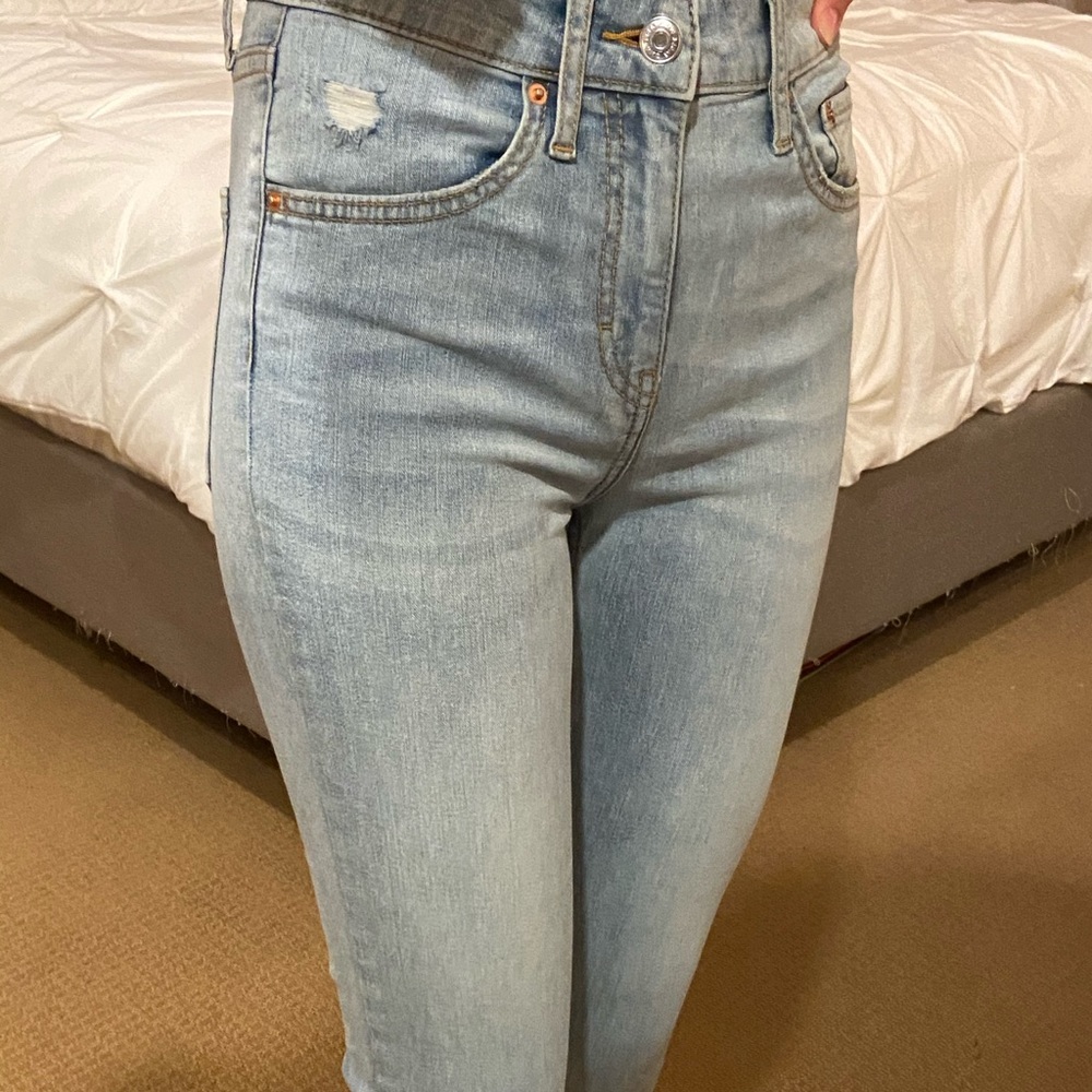 Light wash blue skinny jeans.